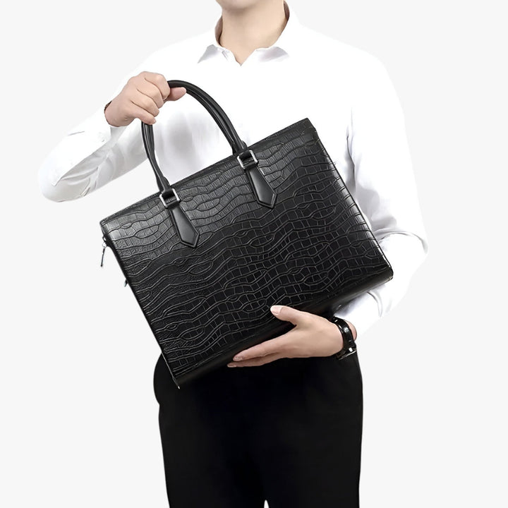Elegante borsa portadocumenti uomo nera con tracolla, capiente per laptop e documenti, perfetta per professionisti.