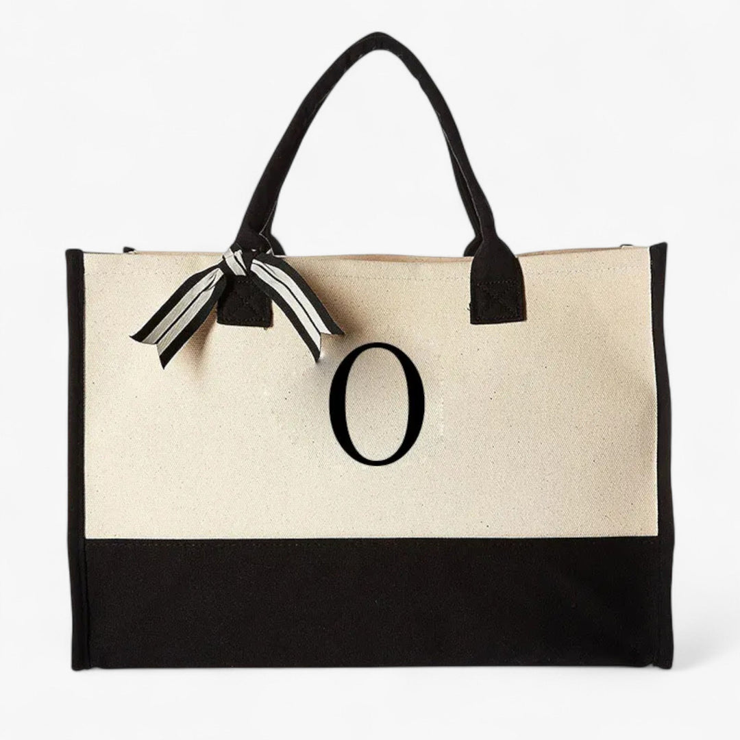 Accessorio donna versatile: borsa tote beige e nera, personalizzabile con iniziale. Ideale per ogni giorno.