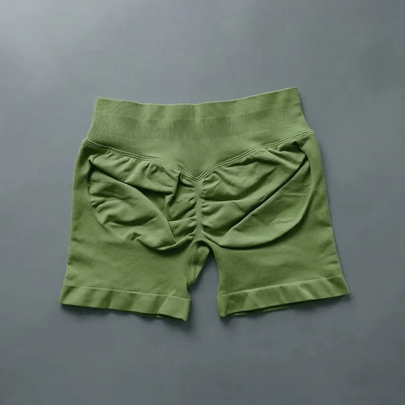 Short fitness donna seamless vita alta, ideali per la corsa e sessioni in sala pesi.