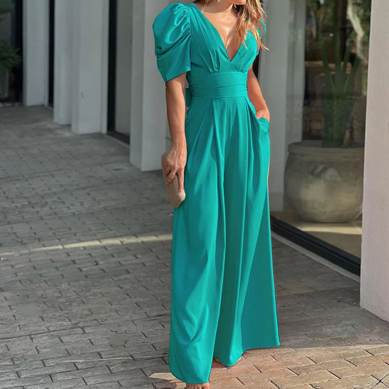 Abbigliamento donna: tuta elegante nera con maniche a palloncino e scollo a V, perfetta per occasioni formali.