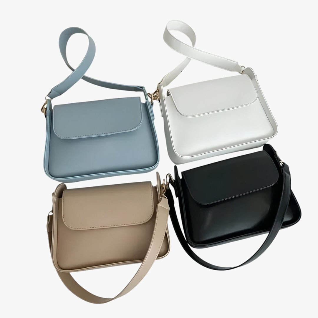 Borsa a tracolla blu compatta, accessorio donna versatile per look quotidiani e viaggi.