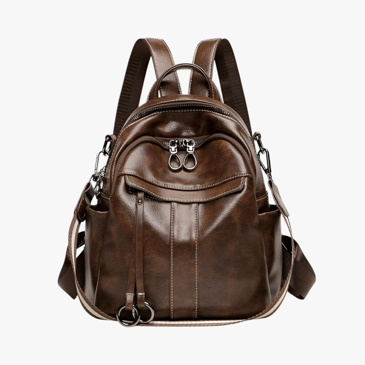 Zaino da donna compatto nero con spallacci regolabili, ideale per viaggio e look casual.