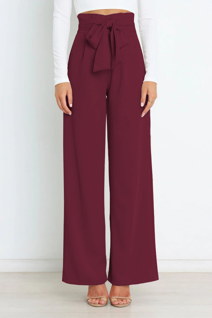 Pantaloni donna larghi a vita alta con cintura. Design moderno e comodo per ogni occasione.