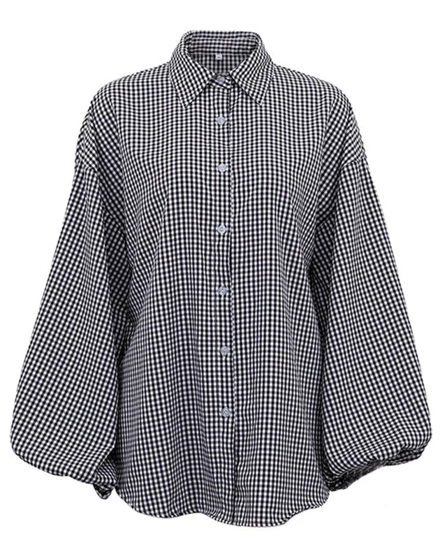 Camicia donna nera a quadri, taglio oversize, con maniche a palloncino. Un capo elegante e di tendenza per lei.