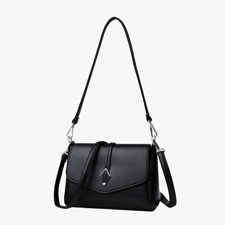Elegante borsa a tracolla da donna con patta, accessorio moda indispensabile per ogni occasione.