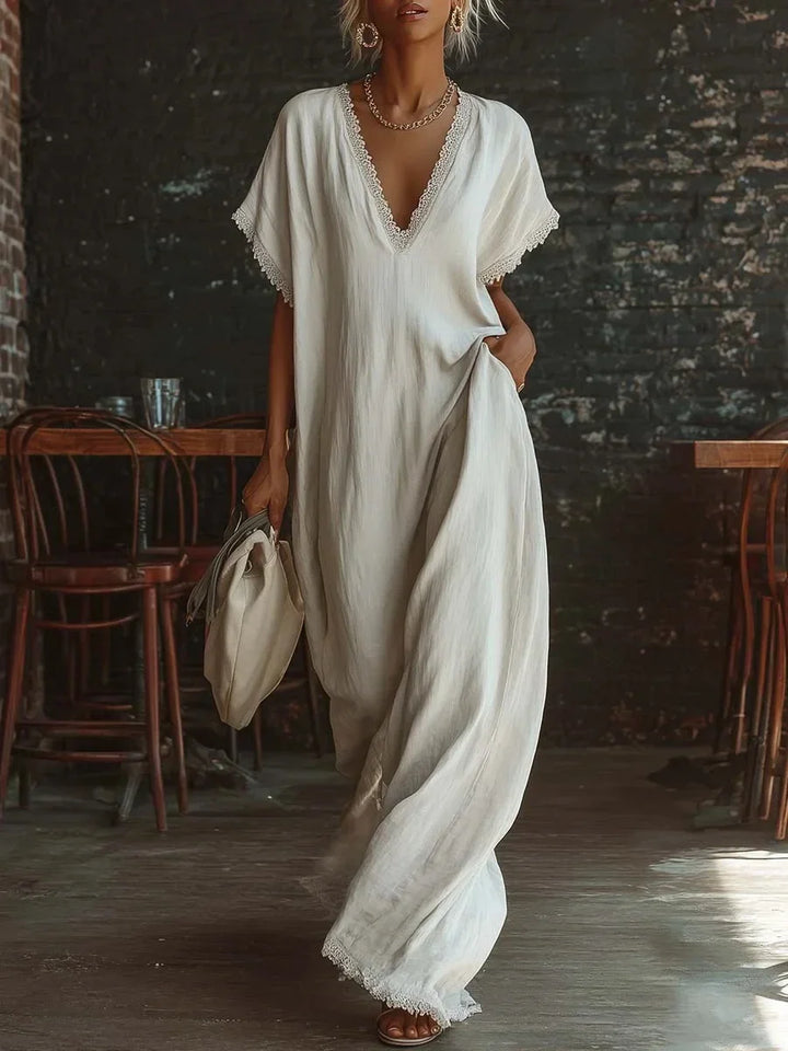Abito lungo donna fluido, stile casual chic, scollo V e dettagli in pizzo, fresco e leggero.