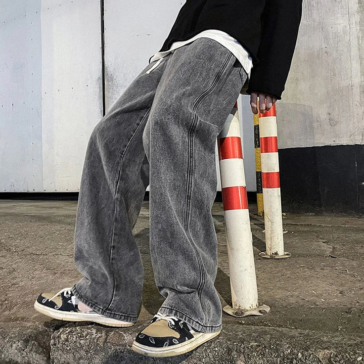 Jeans baggy grigi da uomo, offrono comfort e stile urbano, perfetti per ogni occasione casual.