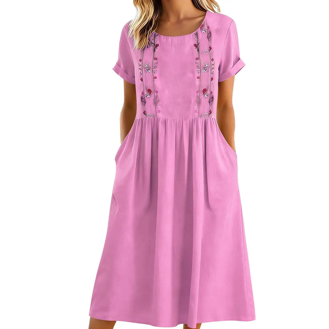 Abito midi floreale donna per comfort ed eleganza, con ricami dettagliati e pratiche tasche laterali. Perfetto per l'estate.