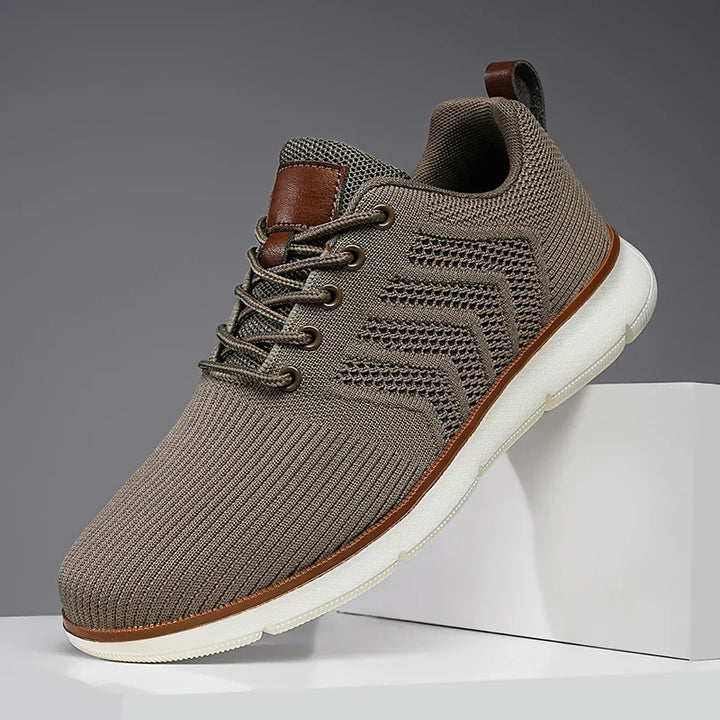 Sneakers uomo casual grigie, comode e flessibili, perfette per l'uso quotidiano.