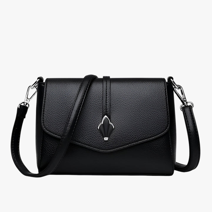 Borsa a tracolla donna versatile, con patta e design elegante. Un accessorio perfetto per ogni giorno.