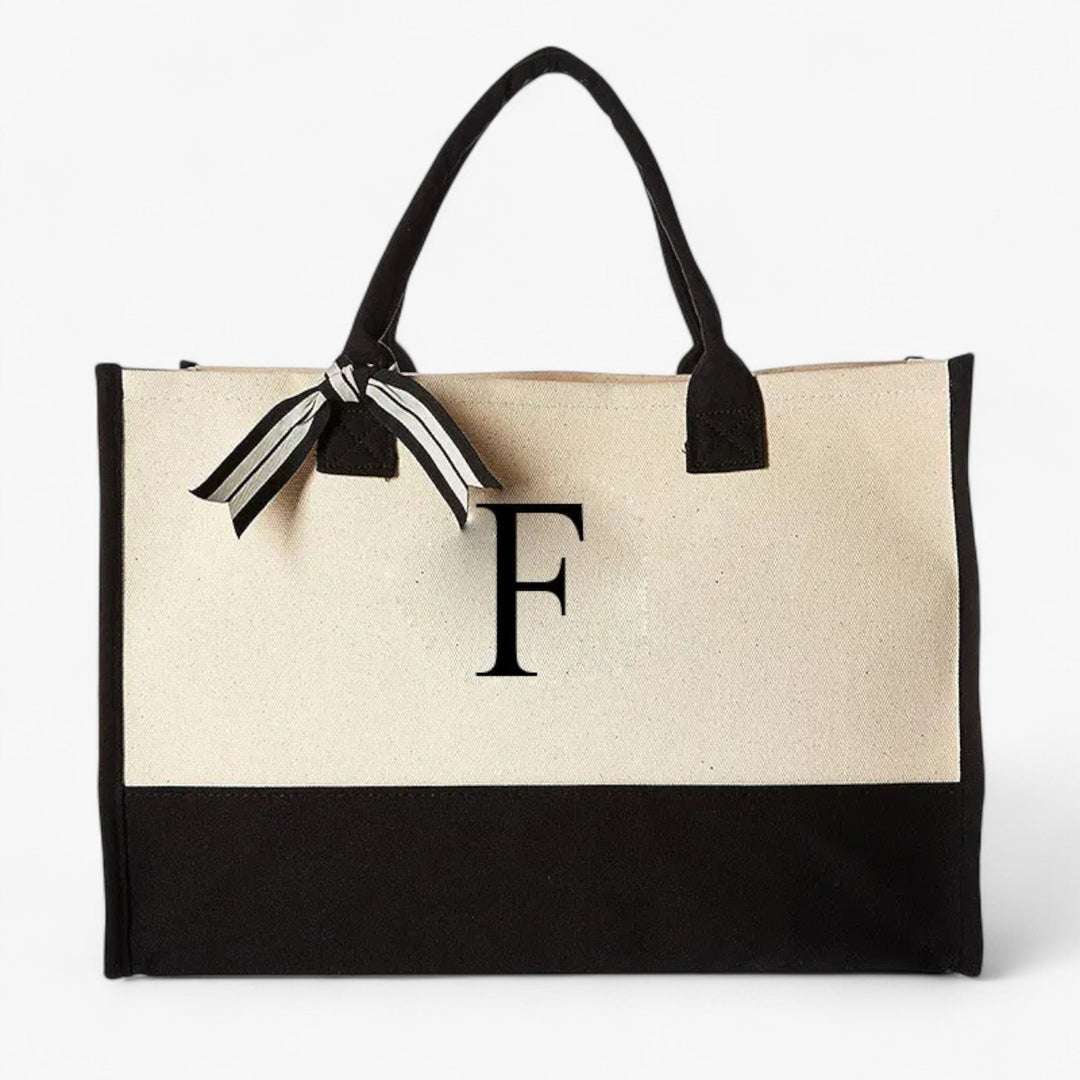 Borsa donna beige e nera con iniziale personalizzata. Tote spaziosa e versatile per il quotidiano.
