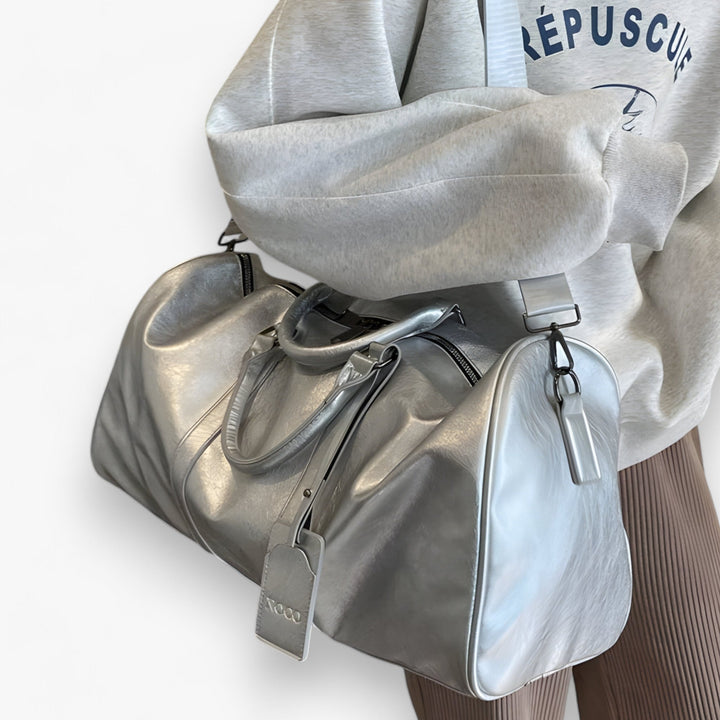 Borsa da viaggio donna capiente con manici robusti, ideale per viaggi e uso frequente.