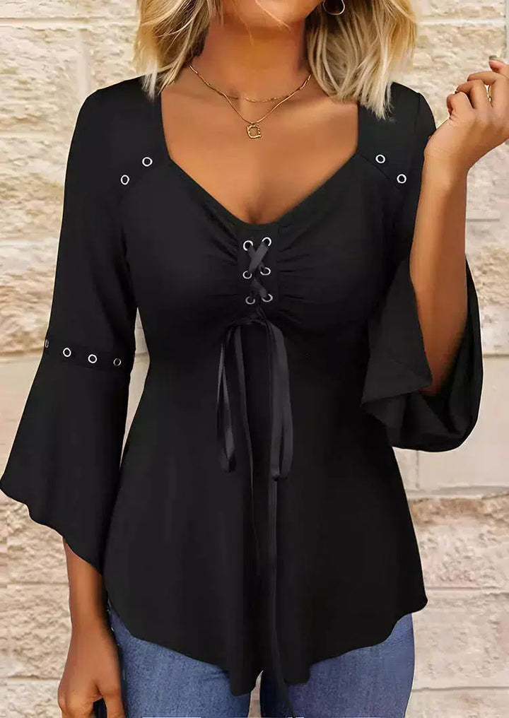 Blusa donna a maniche lunghe con scollo a V. Ideale per abbigliamento quotidiano o come capo chic da ufficio.
