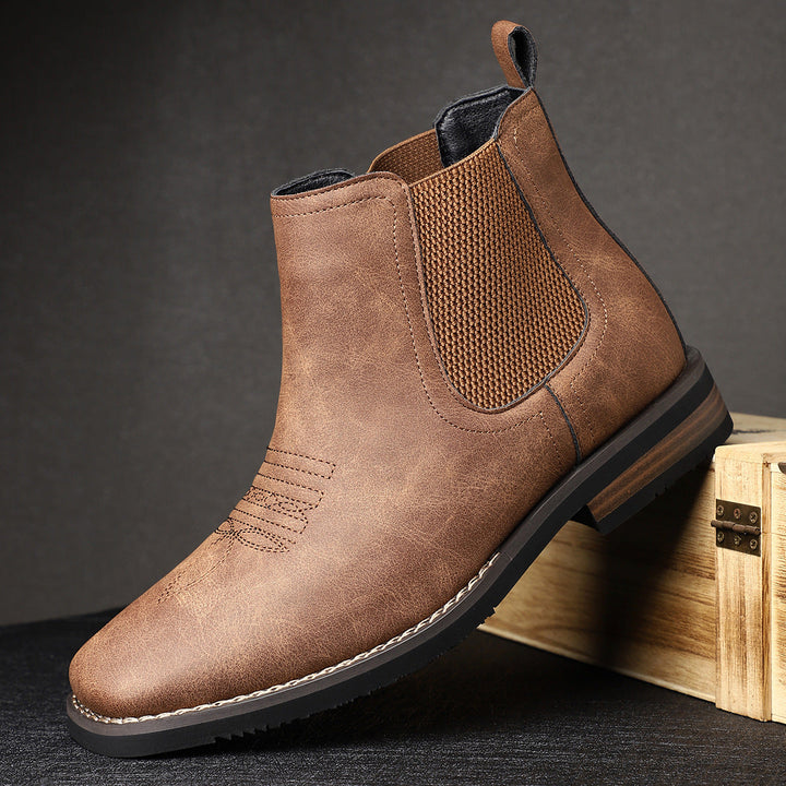 Eleganti stivaletti Chelsea da uomo neri, design slip-on, con suola antiscivolo per comfort e sicurezza.