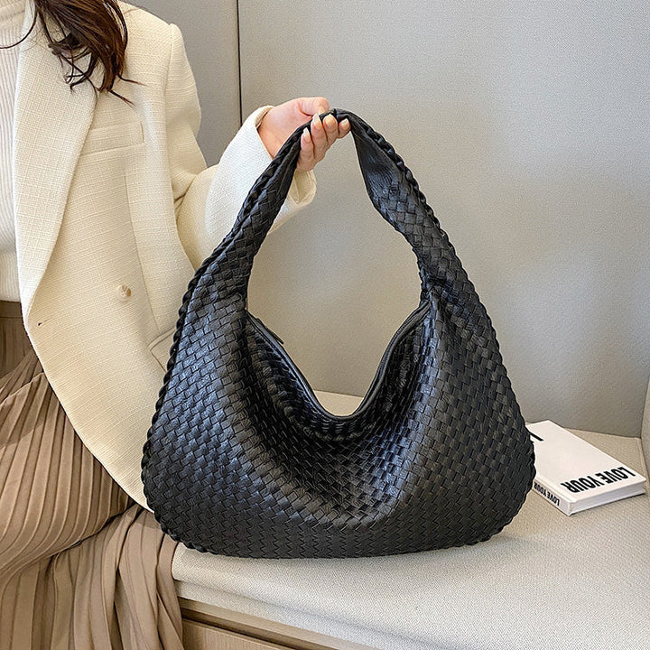 Borsa a tracolla da donna in tessuto, versatile e funzionale per l'uso quotidiano.