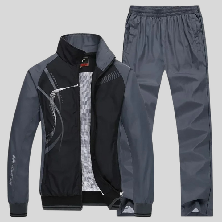 Giacca sportiva e joggers uomo per un completo versatile. Ideale per attività fisica e look casual-chic.