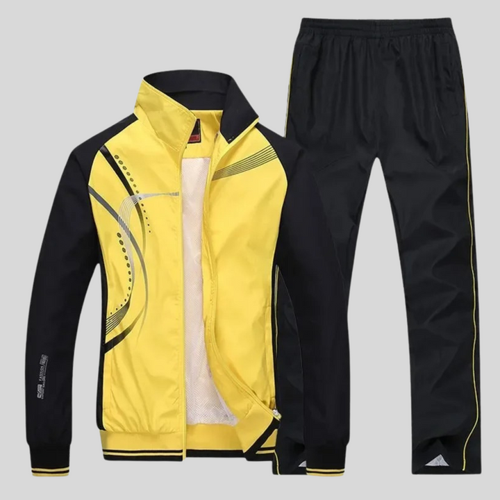 Set sportivo uomo moderno e funzionale. Giacca e joggers per un look dinamico e confortevole in ogni occasione.