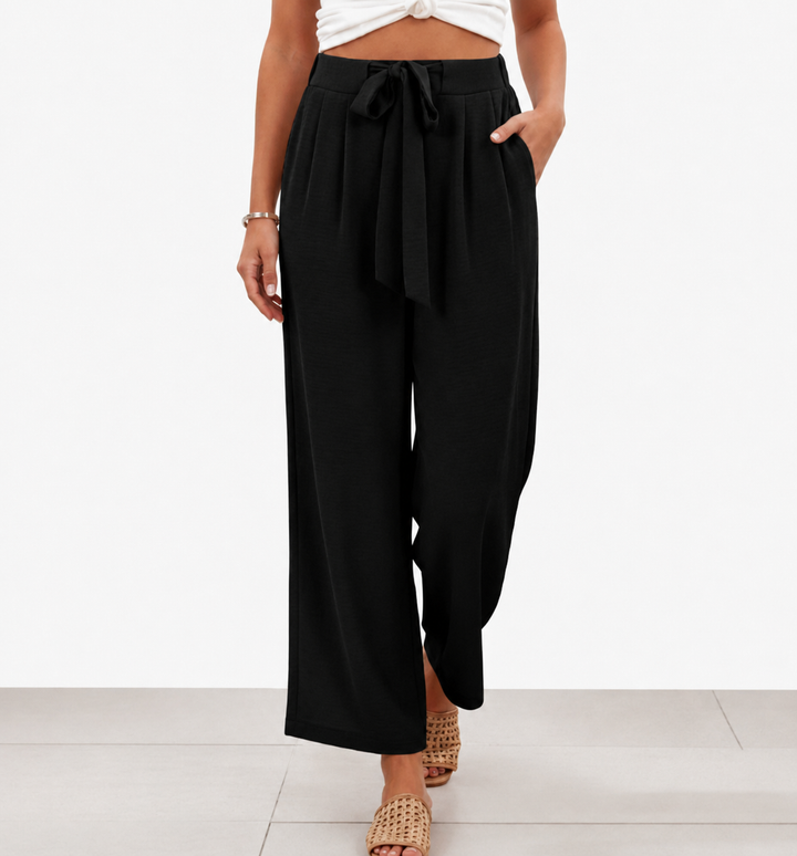 Pantaloni sartoriali donna vita alta con cintura. Eleganti, vestibilità slim, ideali per ufficio o casual chic.