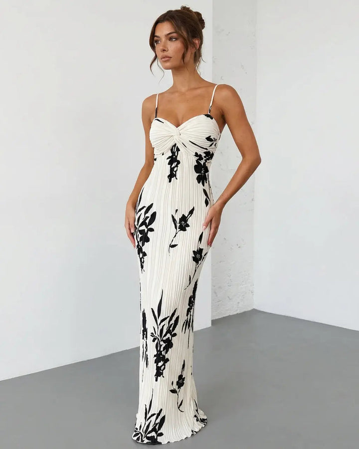 Abito maxi floreale da donna, design elegante con busto twist, perfetto per l'estate e un look femminile.