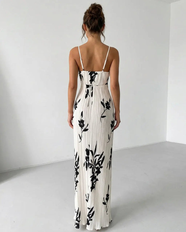 Dettaglio del busto twist su abito maxi floreale da donna, stile elegante e femminile per la moda estiva.