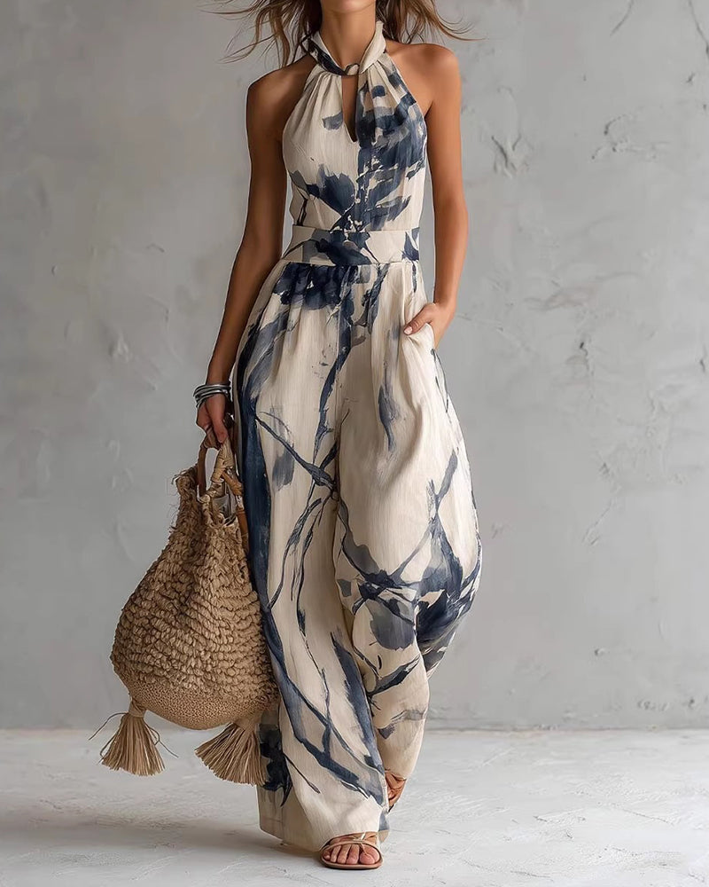 Tuta donna estiva halter con stampa acquerello e pantaloni larghi. Look raffinato e confortevole.
