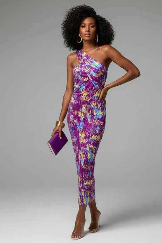 Abito midi da donna chic estivo, in tessuto leggero e femminile, ideale per look eleganti o casual chic da giorno.