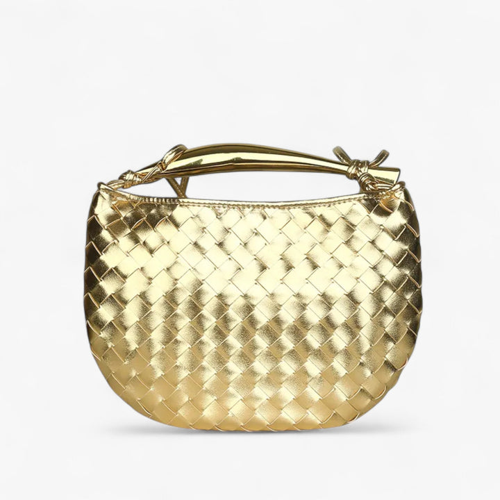 Elegante borsa a mano trapuntata per donna, perfetta come accessorio chic per il viaggio o l'uso quotidiano.