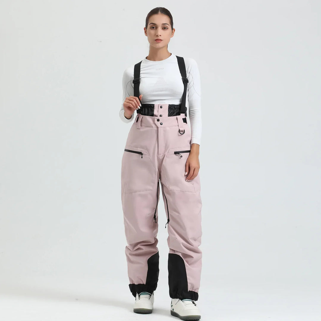 Pantaloni da neve unisex blu scuro, impermeabili e caldi, con bretelle per sci e snowboard.