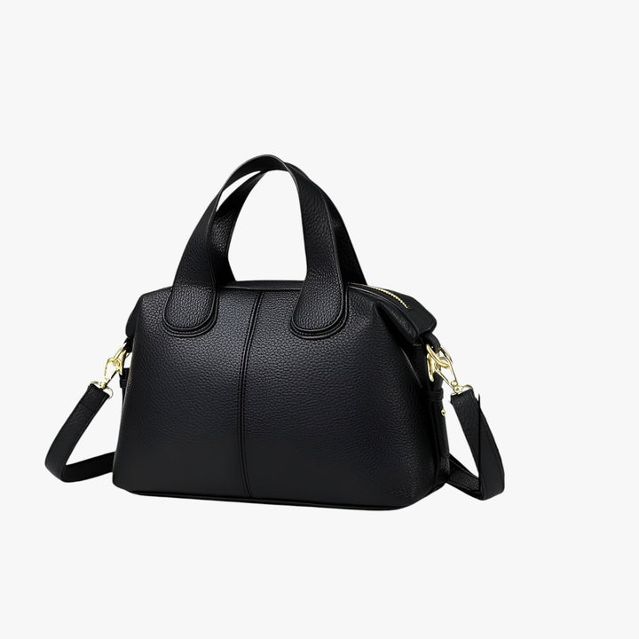 Borsa a mano nera da donna, compatta e versatile, con manici e tracolla, accessorio moda essenziale.