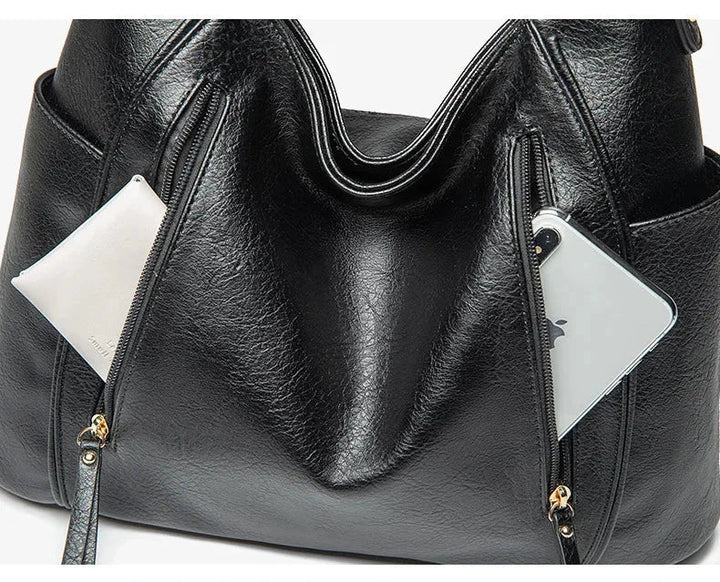Borsa quotidiana donna effetto pelle grigia. Comoda e chic, per affrontare ogni impegno con stile.