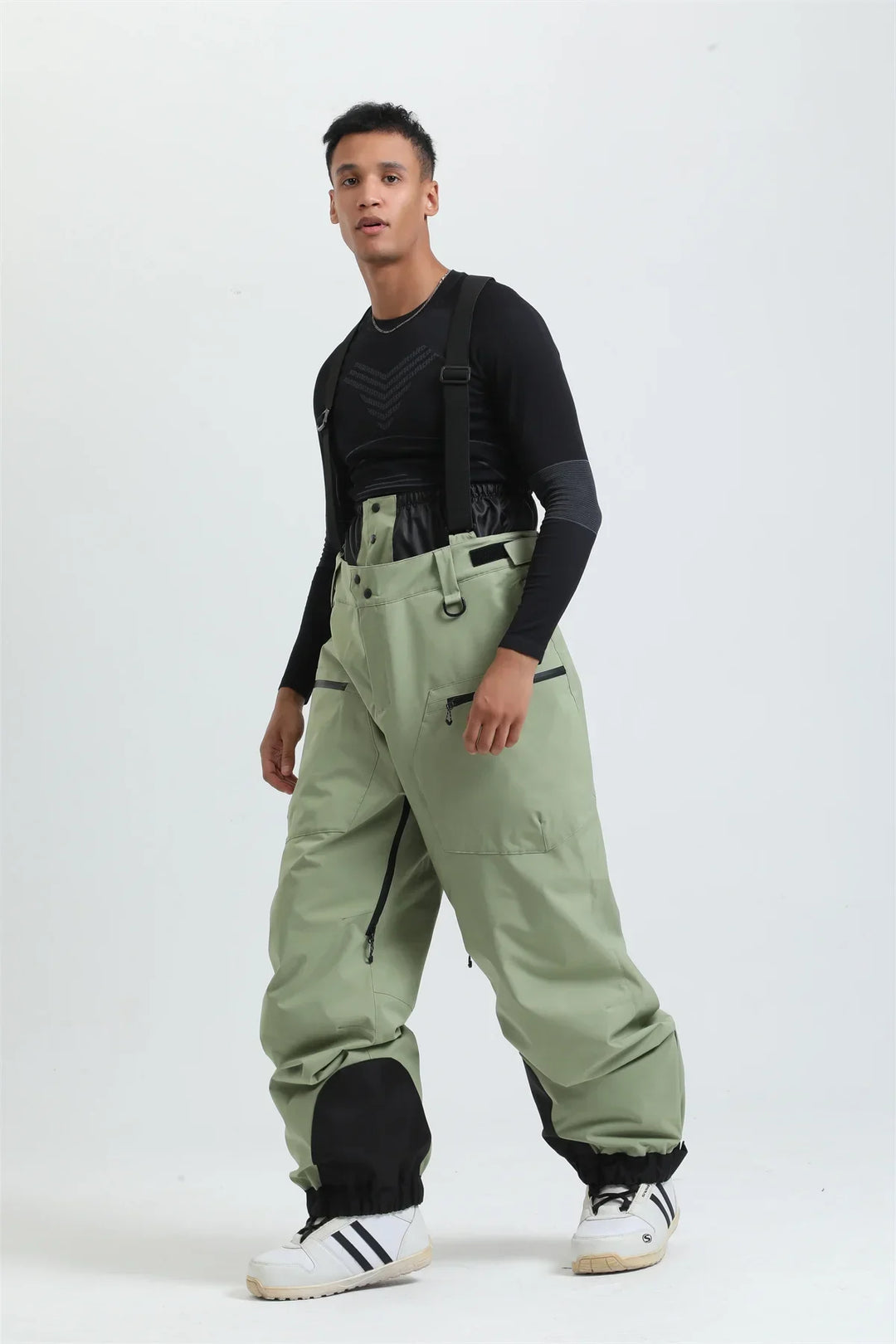 Pantaloni da sci unisex bianchi, impermeabili per sport invernali, con bretelle per la neve.