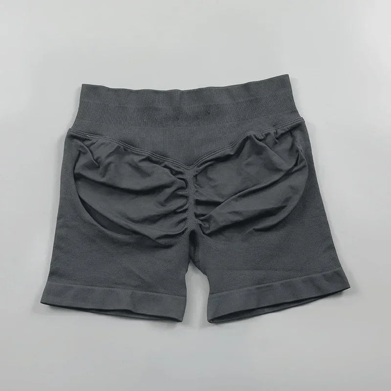 Short fitness donna seamless rosa, vita alta, perfetti per la palestra.