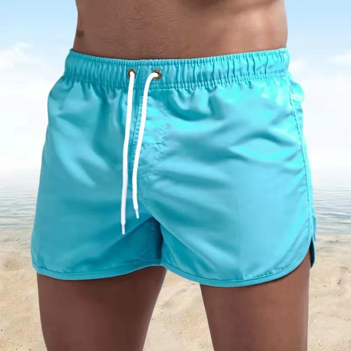 Pantaloncini uomo per mare e sport, con tecnologia ad asciugatura rapida. Perfetti per nuoto e spiaggia.