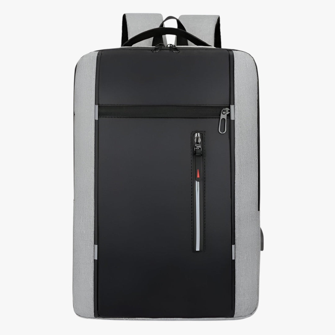 Uomo che indossa uno zaino grigio casual porta laptop 15.6", pratico per università o tempo libero.