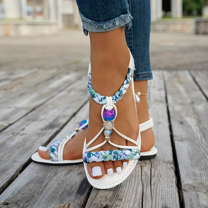 Sandalo infradito estivo donna, design bohémien con fascia superiore intrecciata per un comfort alla moda.