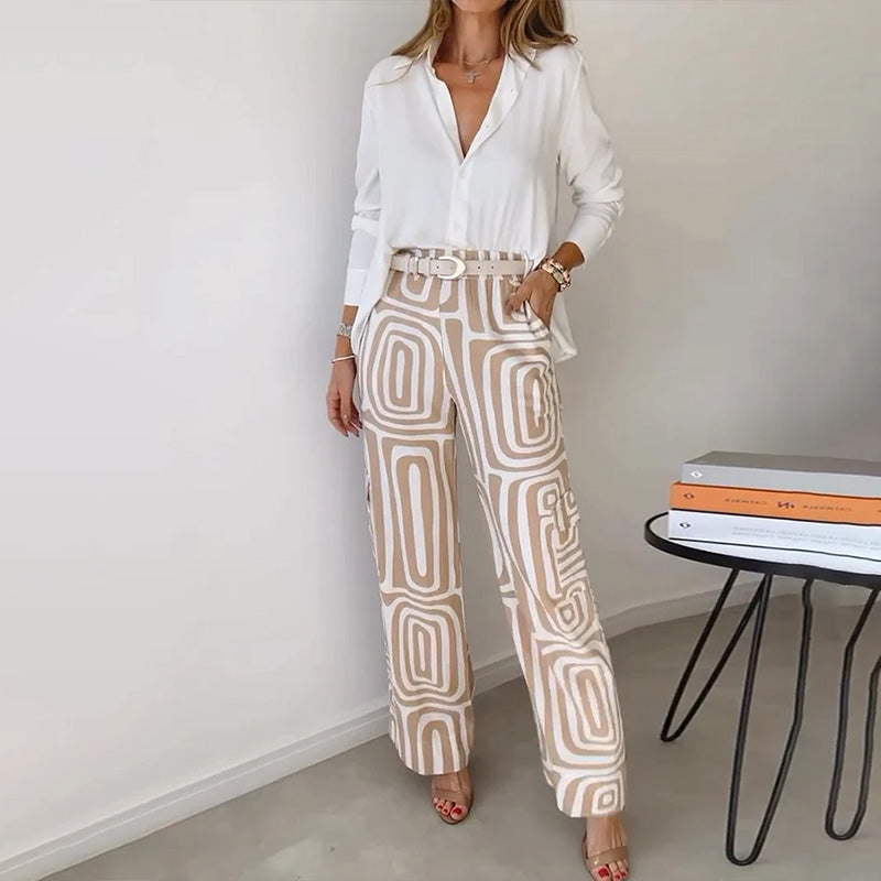 Completo donna elegante primavera con camicia fluida e pantaloni a vita alta gamba larga. Look sofisticato e versatile estivo.