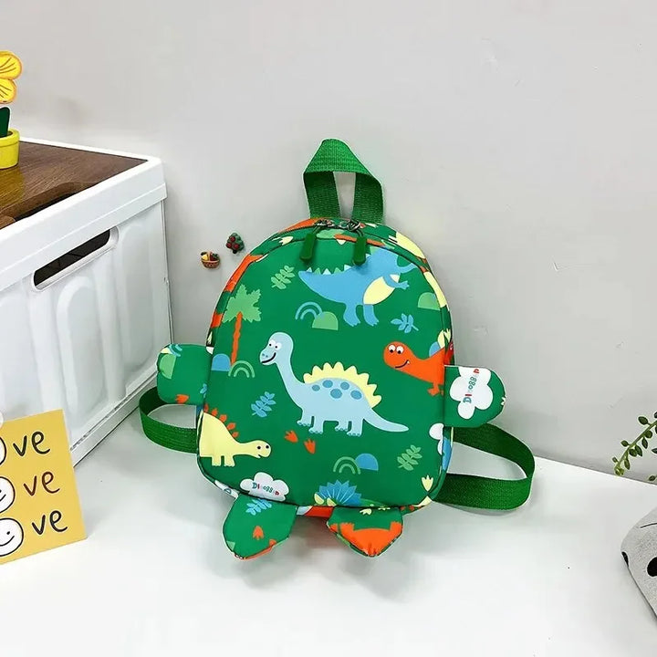 Zainetto bambini dinosauro in nylon, disponibile in rosso, nero e rosa, leggero per asilo.