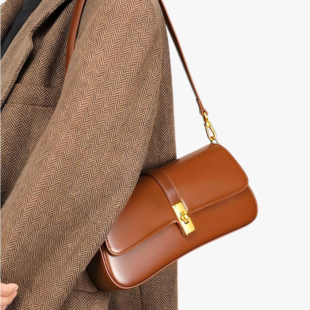 Piccola borsa baguette rosso vino elegante per donna, ideale come accessorio da viaggio compatto.