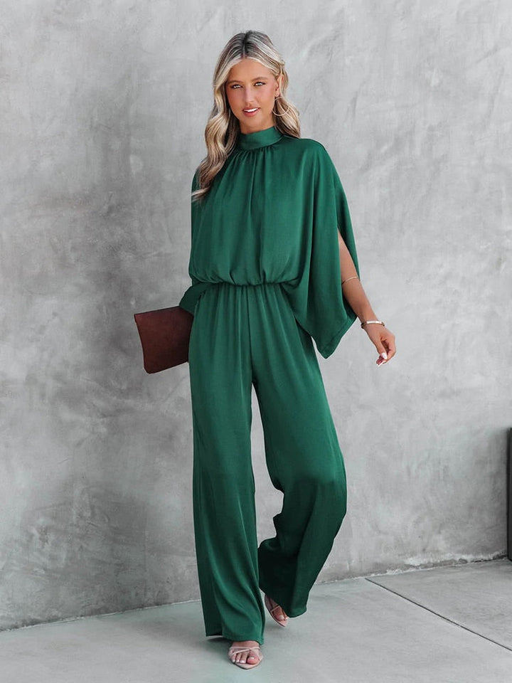Tuta elegante donna verde a pantaloni ampi, perfetta per cerimonie ed eventi speciali. Outfit formale da sera.