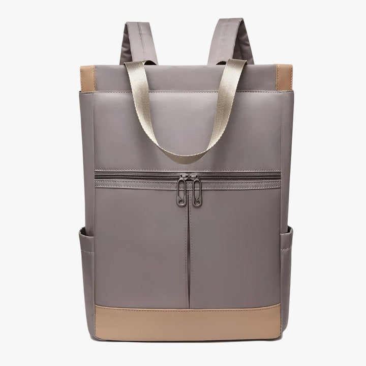 Zaino unisex minimalista ed elegante in colore neutro, perfetto per l'ufficio o il tempo libero, dal design pulito.