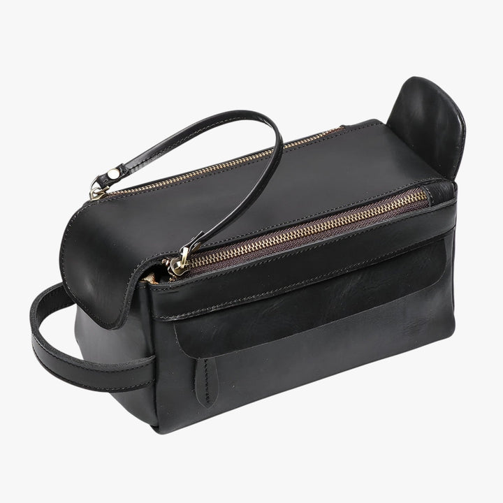 Beauty case uomo pratico nero, design elegante e multiscomparto per toilette e accessori da viaggio.