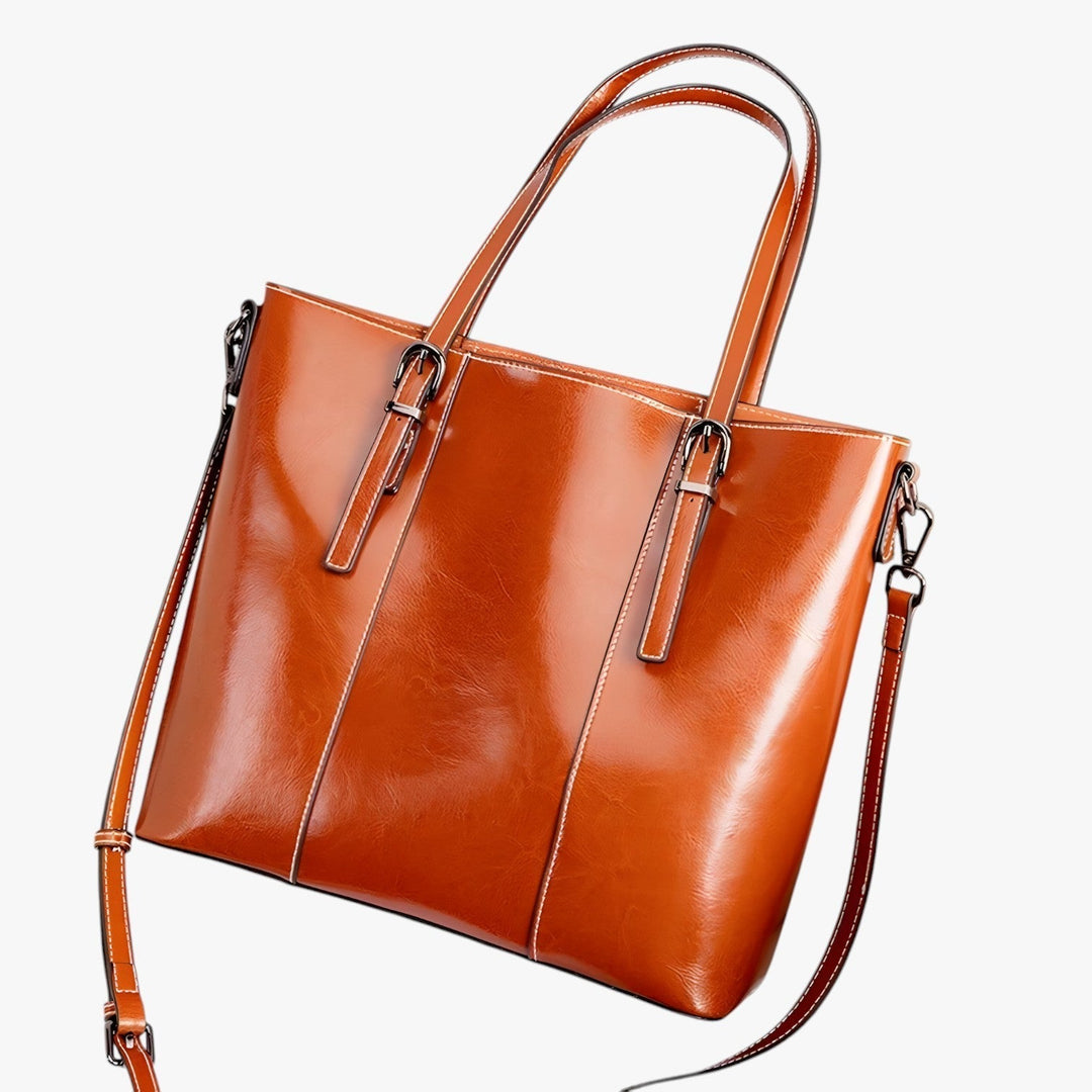 Borsa tote marrone scuro, accessorio donna versatile. Ideale per lavoro, shopping o viaggi eleganti.