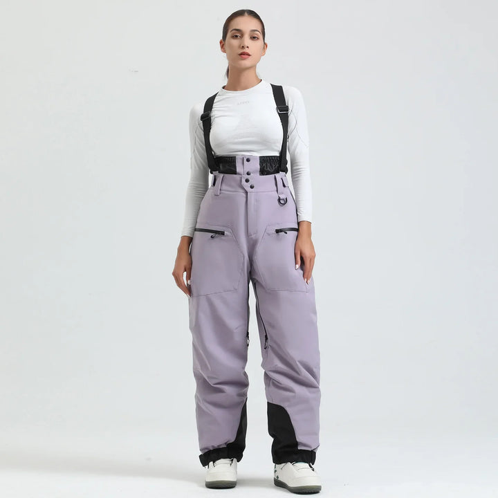 Pantaloni da sci e snowboard unisex viola, impermeabili, con bretelle per neve e freddo estremo.