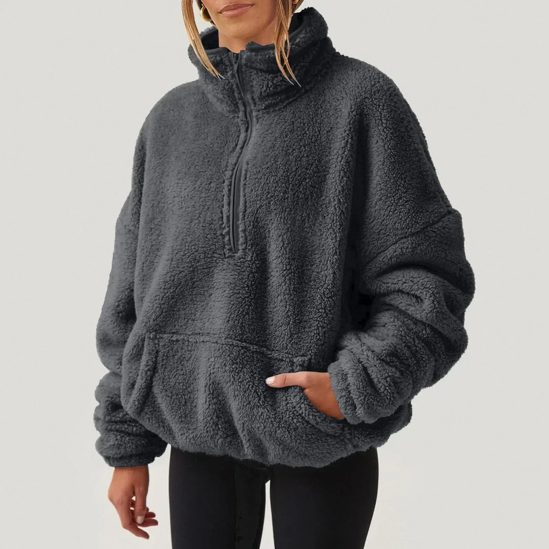 Maglieria donna a maniche lunghe, vestibilità comoda, stile casual con mezza zip. Ideale per ogni giorno.