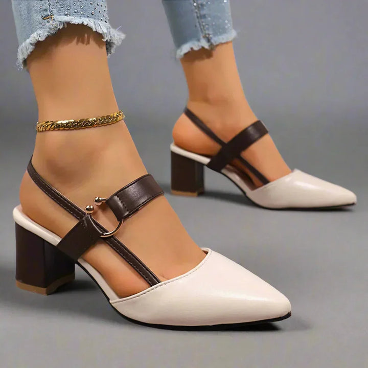 Calzature slingback donna con tacco largo, design elegante e supporto plantare per un comfort duraturo.