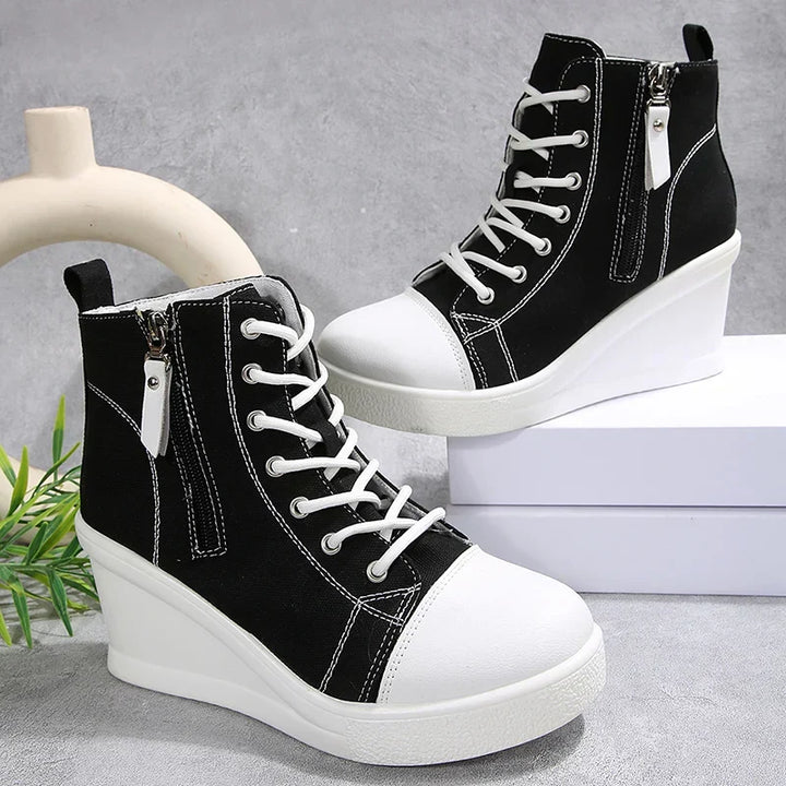 Sneakers donna alla moda con zeppa nascosta, zip e allacciatura. Design contemporaneo e confortevole.