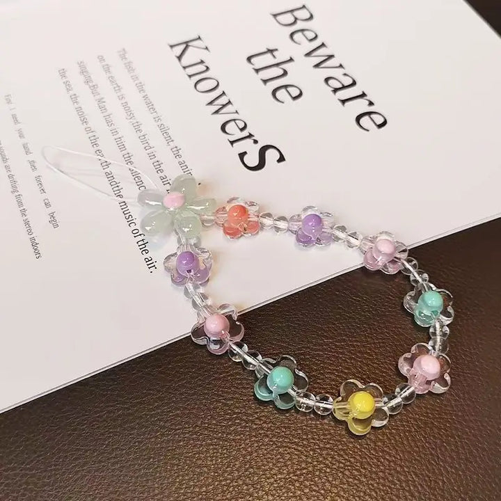 Laccetto telefono donna, perline colorate macaron e fiore, un regalo perfetto per gli amanti della moda.