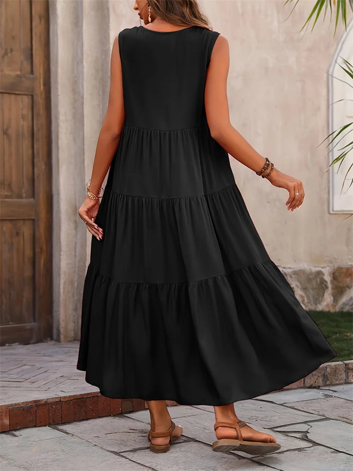 Abito lungo donna estivo, senza maniche, con balze e scollo a V. Perfetto per il tuo outfit casual.