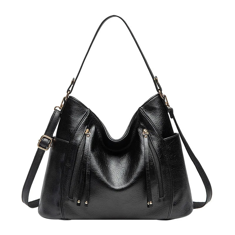 Borsa donna nera effetto pelle, con texture sofisticata. Ideale per un look elegante e professionale.