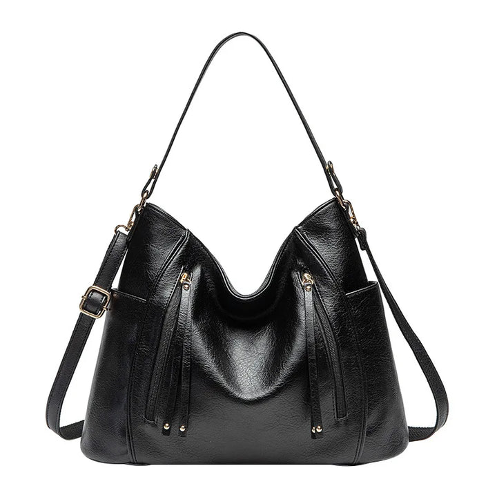 Borsa donna nera effetto pelle, con texture sofisticata. Ideale per un look elegante e professionale.